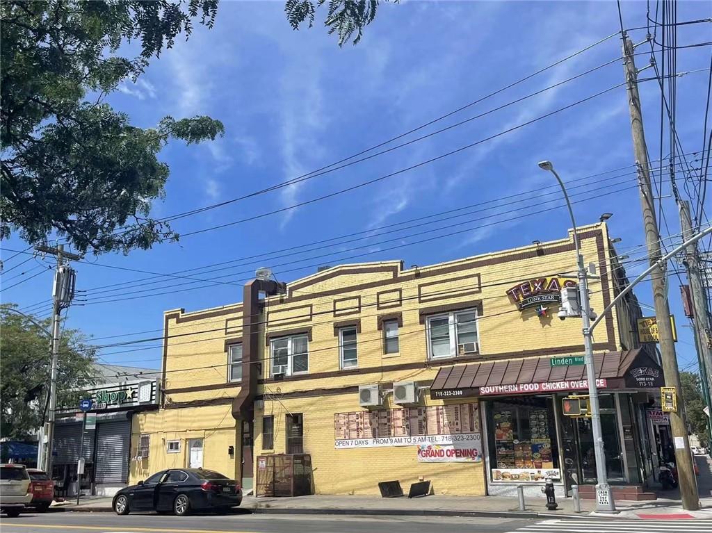 113-18 Sutphin Boulevard Queens, NY 11435 - Photo 2 of 3 a front view of a building with street