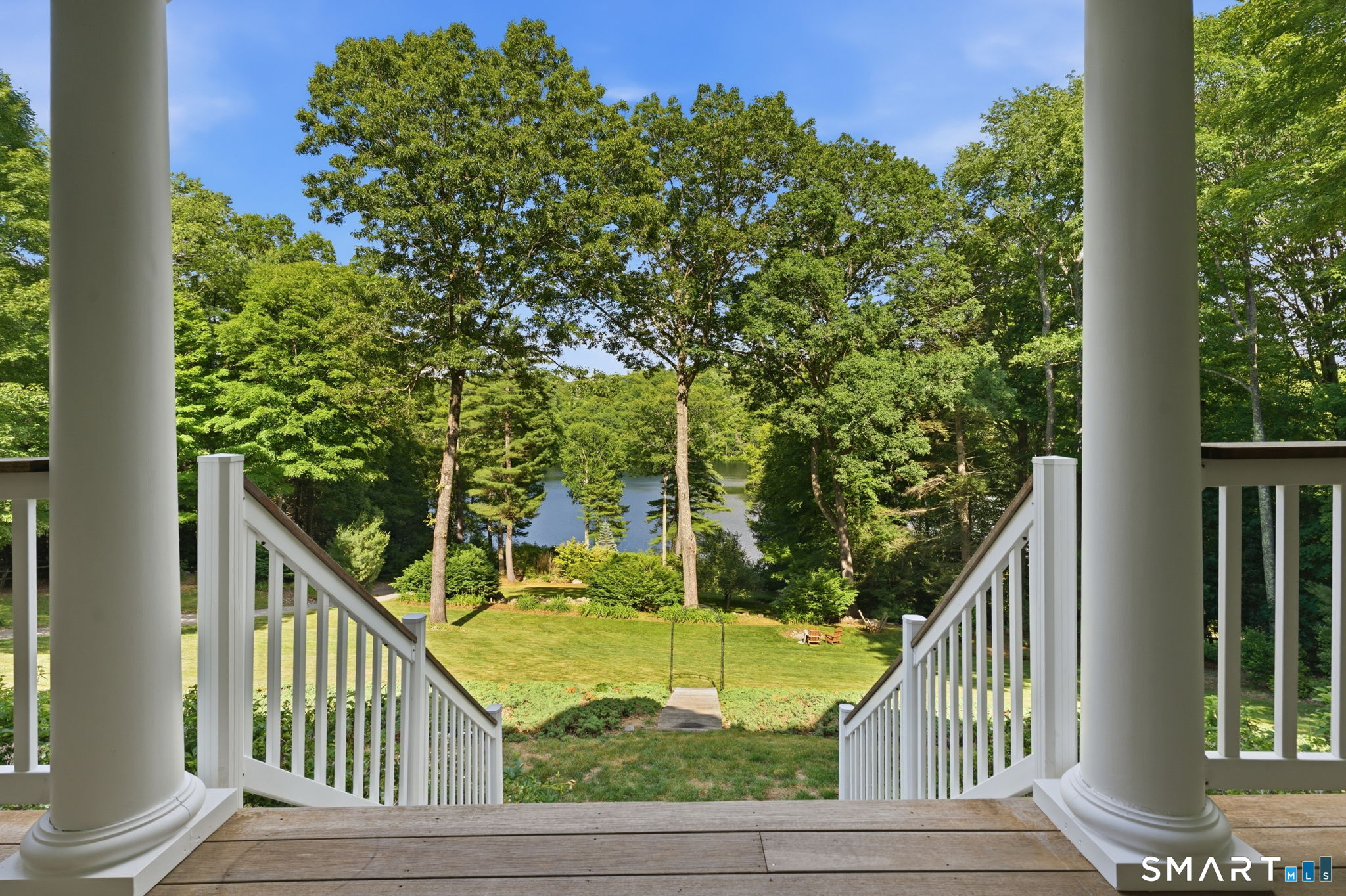 95 Pole Bridge Road Woodstock, CT 06281 - Photo 26 of 40 Steps down to the backyard from the covered deck