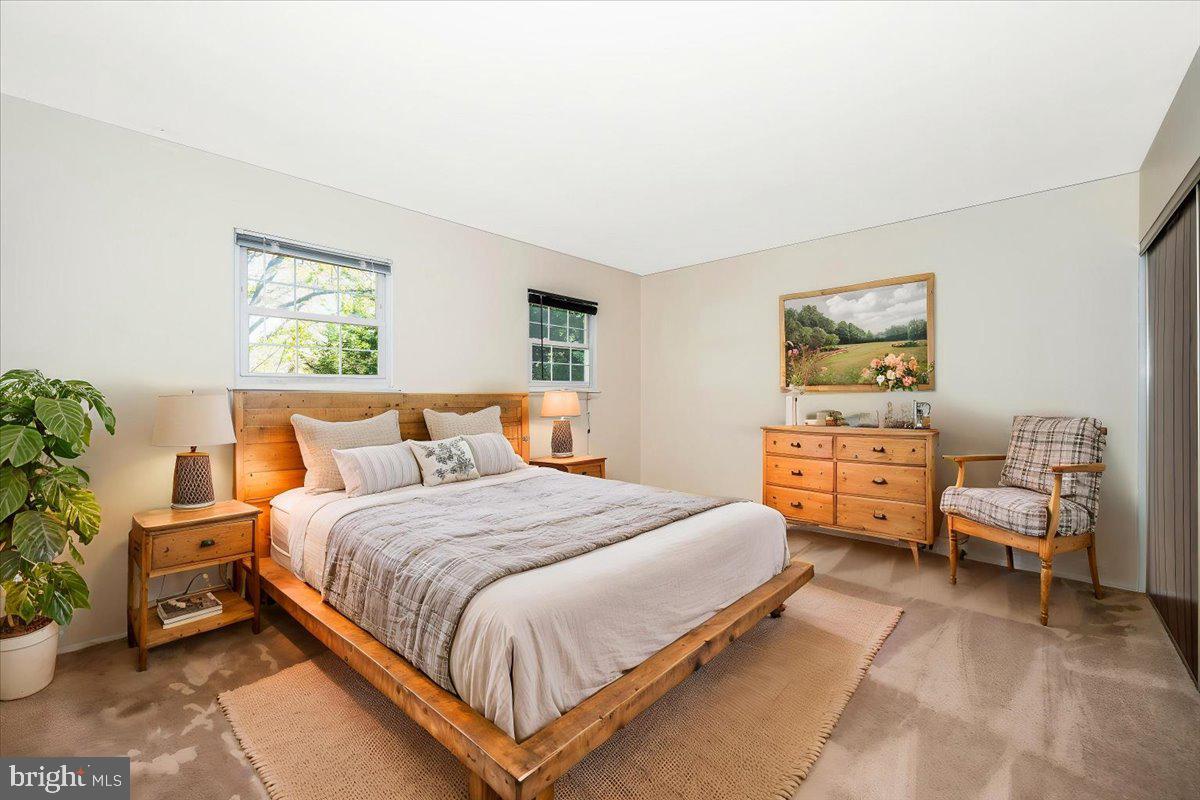 17305 Hoskinson Road Poolesville, MD 20837 - Photo 20 of 81 a bedroom with a bed and a couch