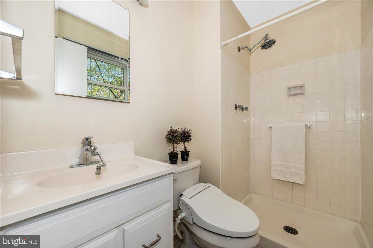 17305 Hoskinson Road Poolesville, MD 20837 - Photo 22 of 81 a bathroom with a sink a toilet and shower