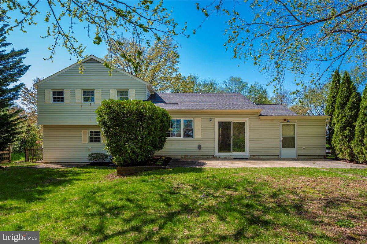 17305 Hoskinson Road Poolesville, MD 20837 - Photo 40 of 81 a front view of house with yard and trees in the background