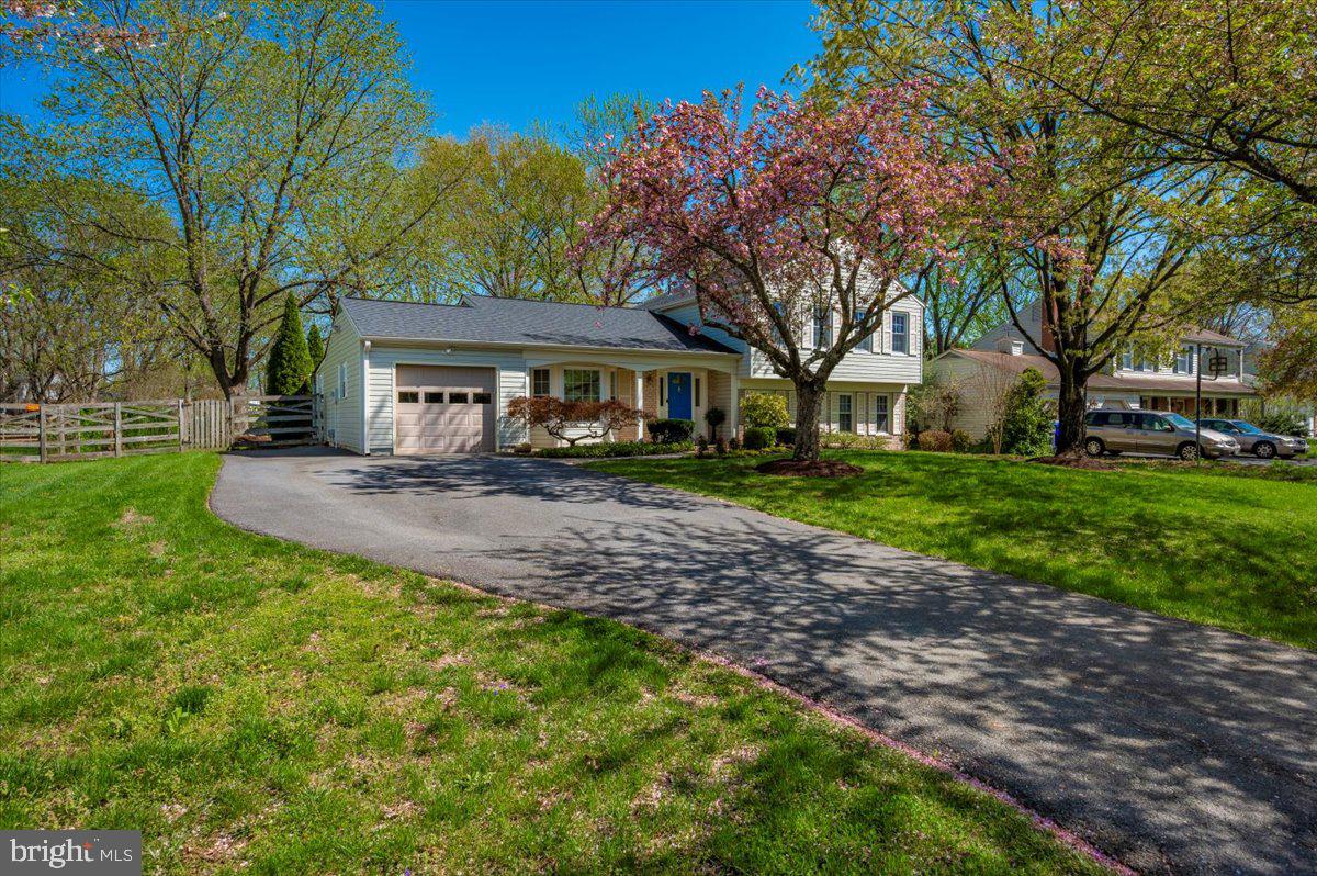 17305 Hoskinson Road Poolesville, MD 20837 - Photo 49 of 81 a front view of a house with garden