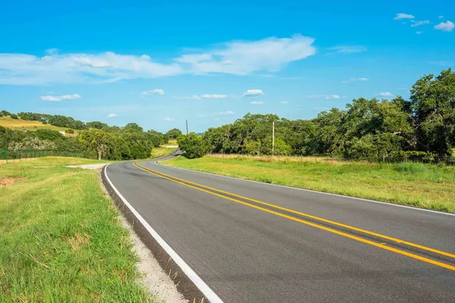a view of a yard with an ocean view