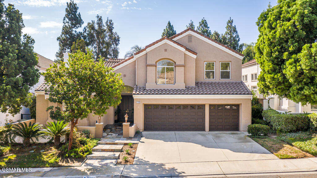 a front view of a house with a garage