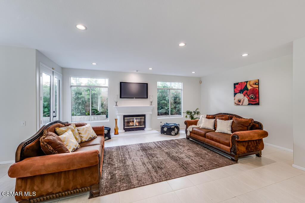 11292 Broadview Drive Moorpark, CA 93021 - Photo 21 of 58 a living room with furniture fireplace and flat screen tv