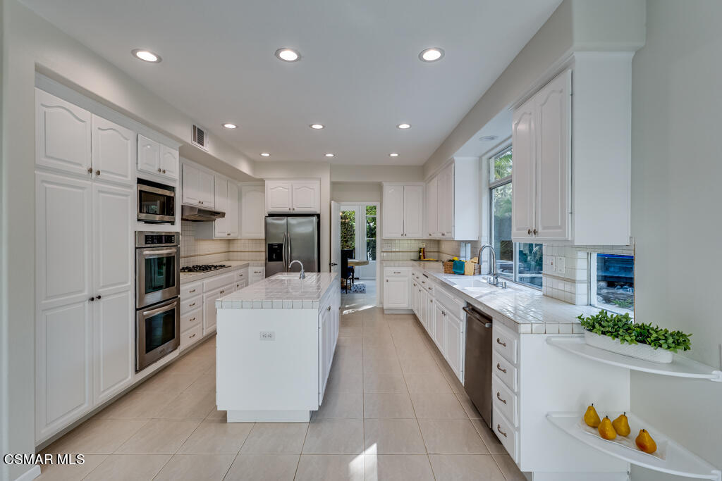 11292 Broadview Drive Moorpark, CA 93021 - Photo 29 of 58 a large kitchen with stainless steel appliances lots of counter space and windows