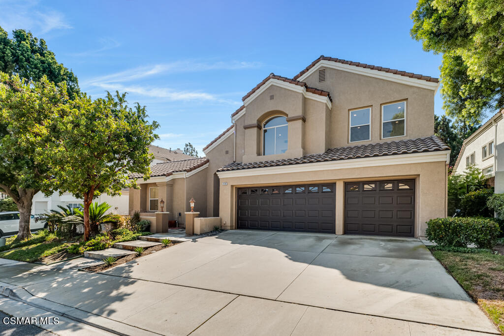 11292 Broadview Drive Moorpark, CA 93021 - Photo 3 of 58 a front view of a house with a yard and garage