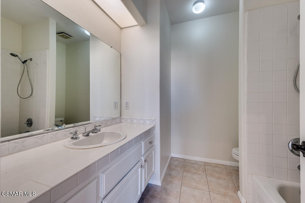 11292 Broadview Drive Moorpark, CA 93021 - Photo 34 of 58 a bathroom with a sink and a mirror