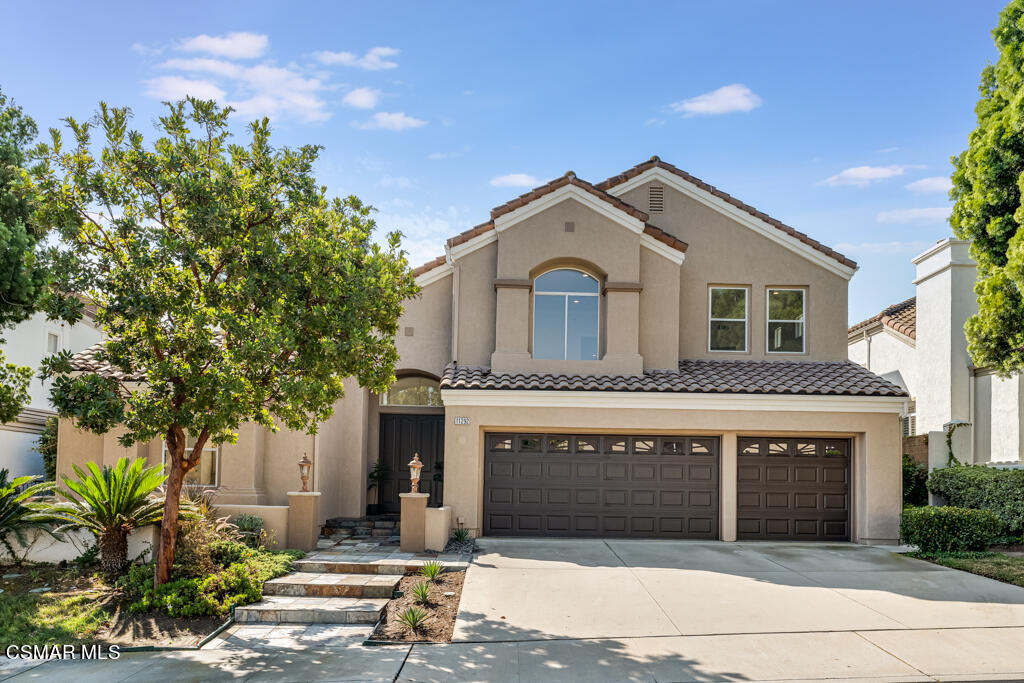 11292 Broadview Drive Moorpark, CA 93021 - Photo 4 of 58 a front view of a house with a garden