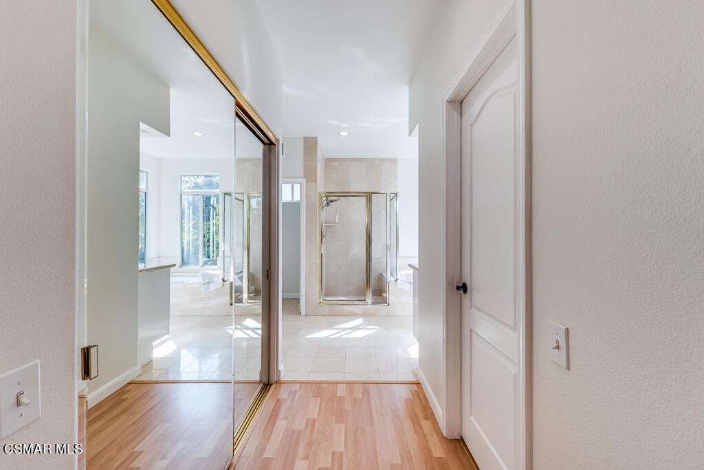 11292 Broadview Drive Moorpark, CA 93021 - Photo 43 of 58 a view of a hallway with wooden floor and a living room