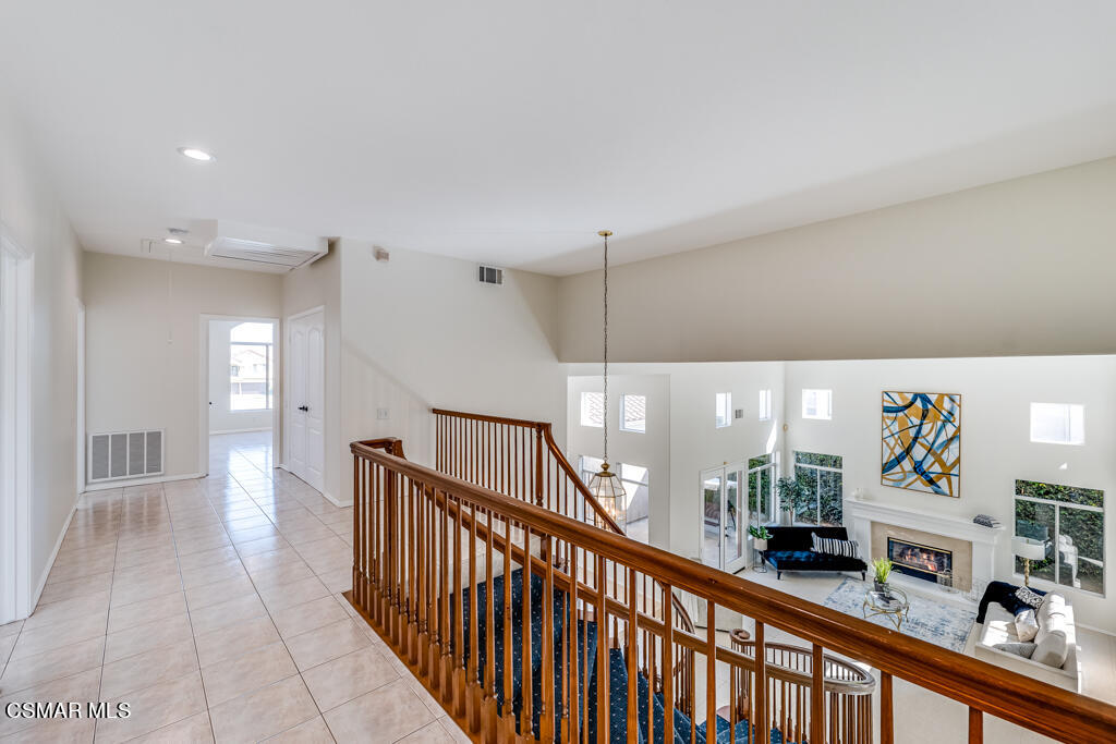 11292 Broadview Drive Moorpark, CA 93021 - Photo 47 of 58 a view of a hallway with dining room and wooden floor