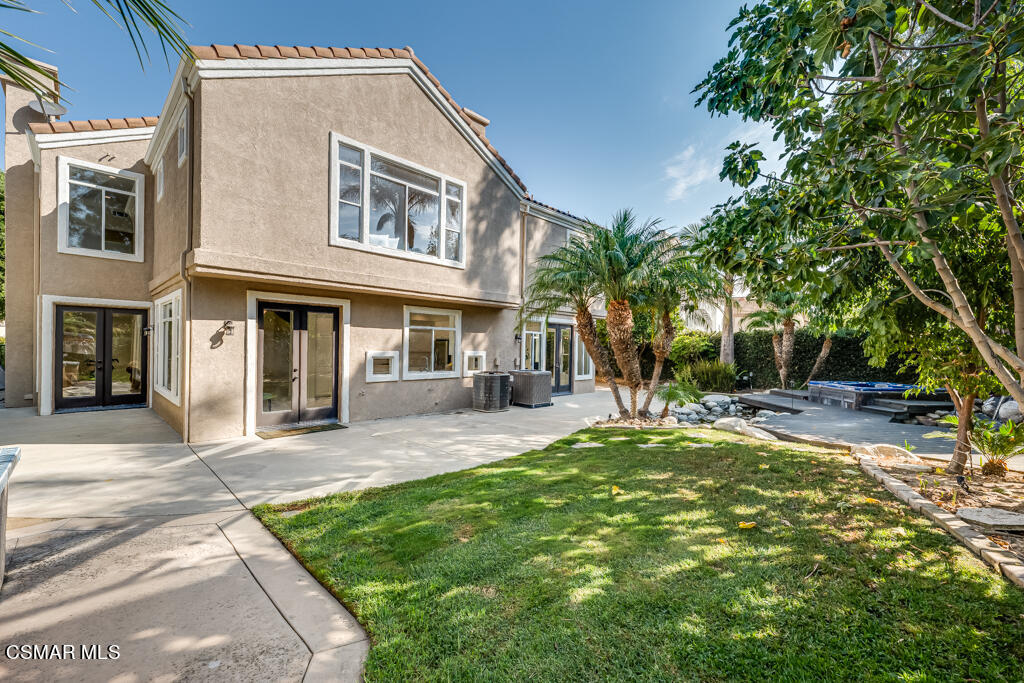 11292 Broadview Drive Moorpark, CA 93021 - Photo 49 of 58 a view of a brick house with a yard plants and large tree