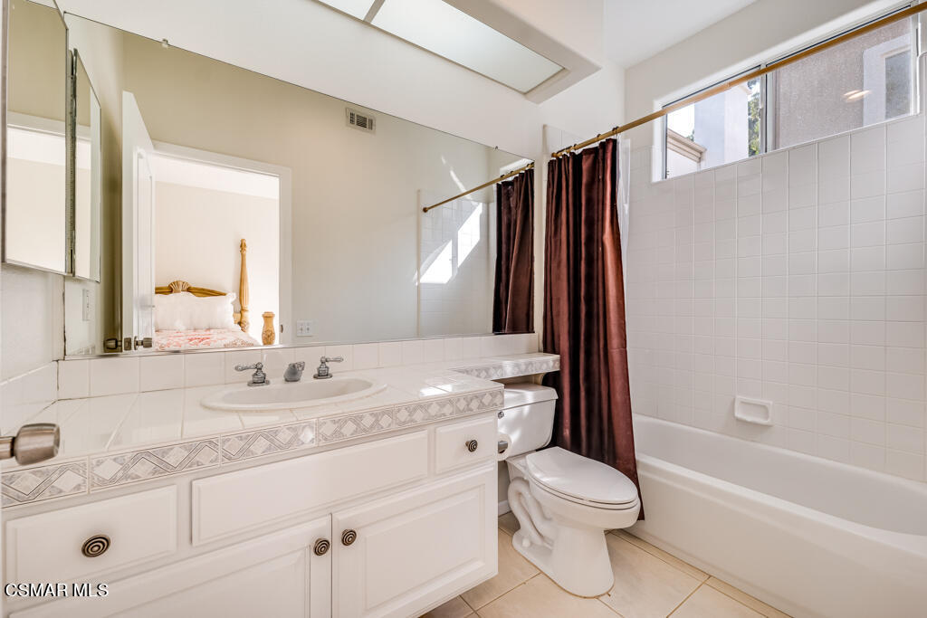 11292 Broadview Drive Moorpark, CA 93021 - Photo 10 of 58 a bathroom with a granite countertop sink toilet and shower