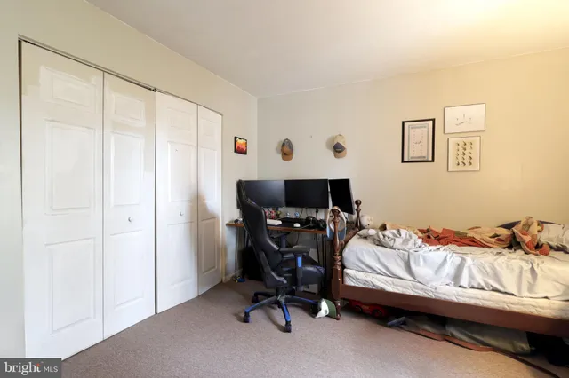 a view of a white house with a yard