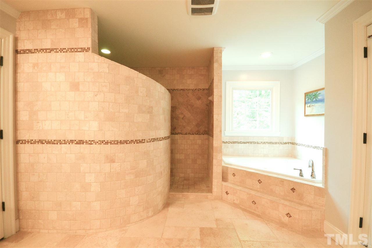 266 Waterville Street Raleigh, NC 27603 - Photo 22 of 30 a bathroom with a bathtub and a shower