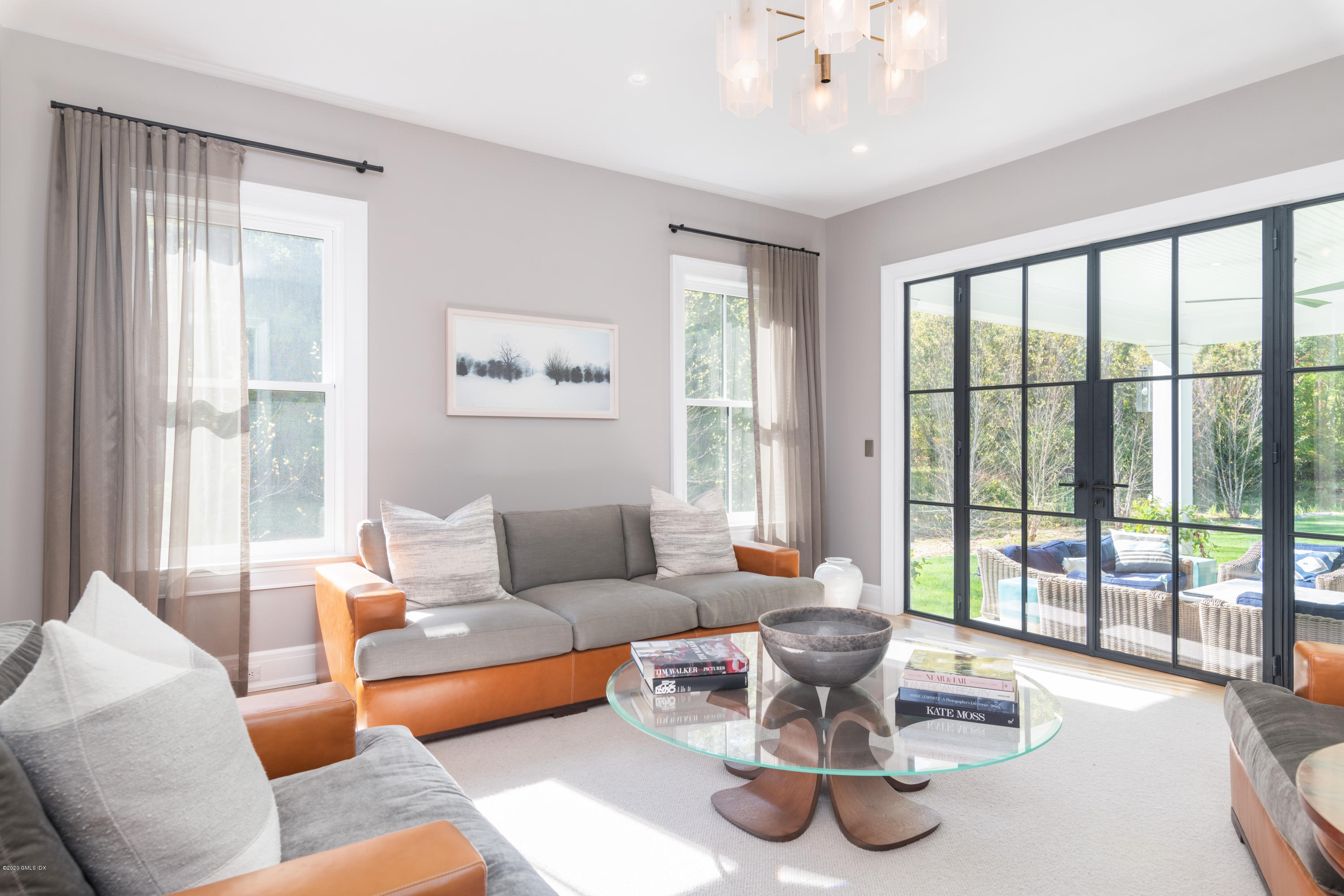 201 Clapboard Ridge Road Greenwich, CT 06831 - Photo 11 of 28 a living room with couch and a large window with garden view