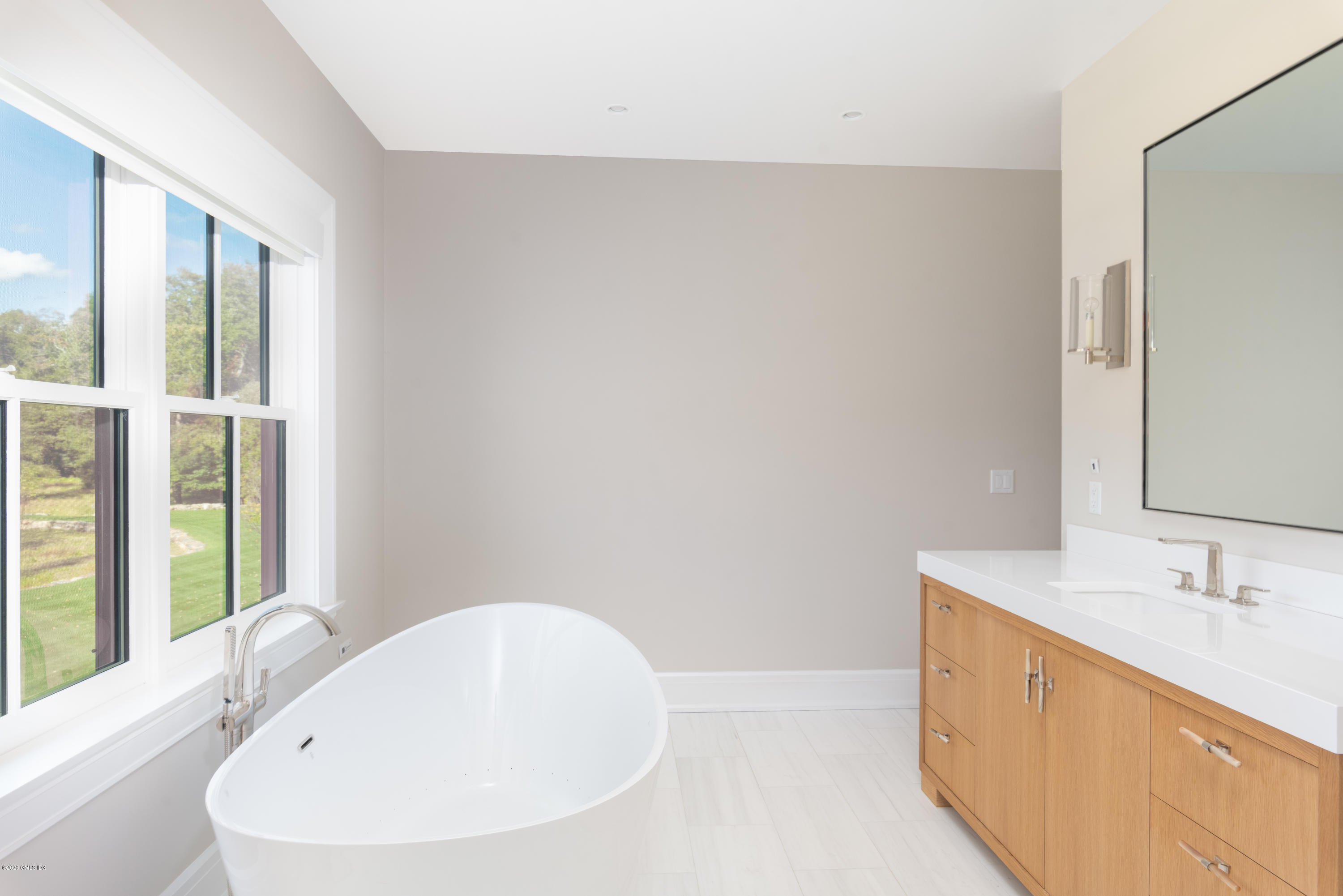 201 Clapboard Ridge Road Greenwich, CT 06831 - Photo 17 of 28 a bathroom with a bathtub and a sink