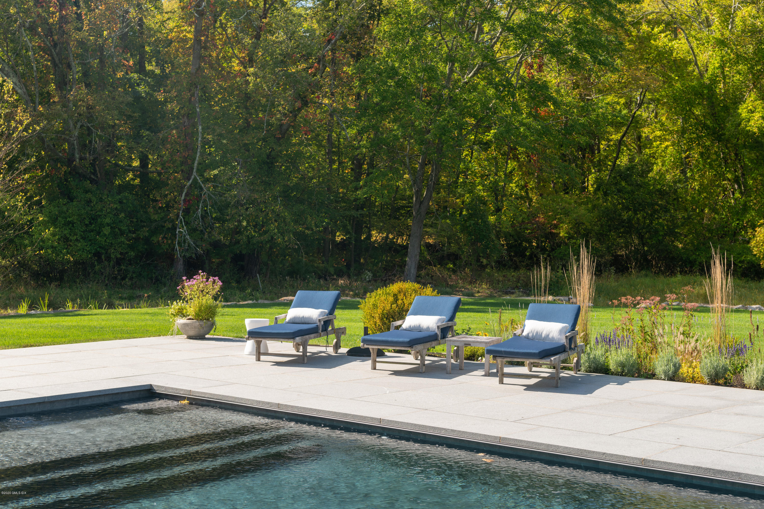 201 Clapboard Ridge Road Greenwich, CT 06831 - Photo 27 of 28 a view of backyard with swimming pool and sitting area