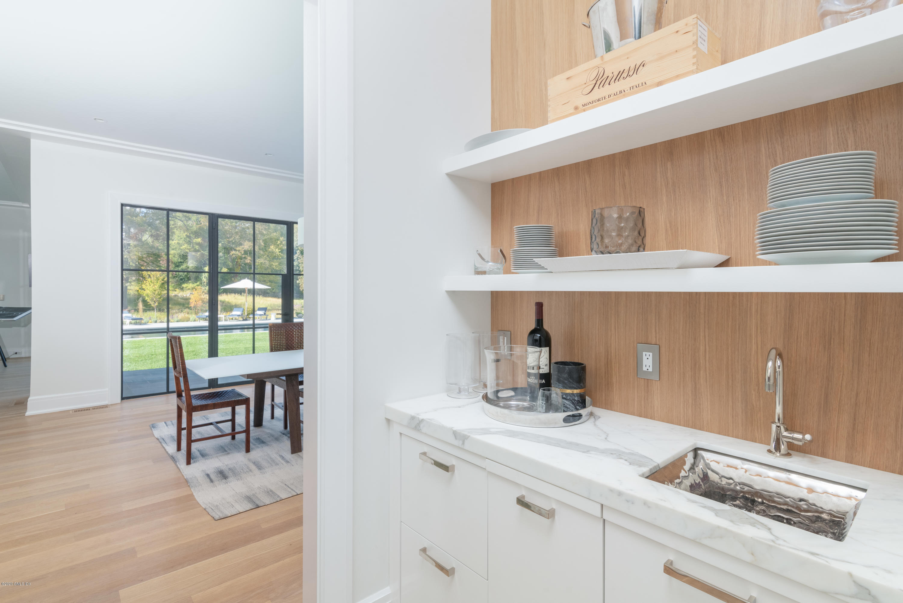 201 Clapboard Ridge Road Greenwich, CT 06831 - Photo 9 of 28 a kitchen with a sink and cabinets