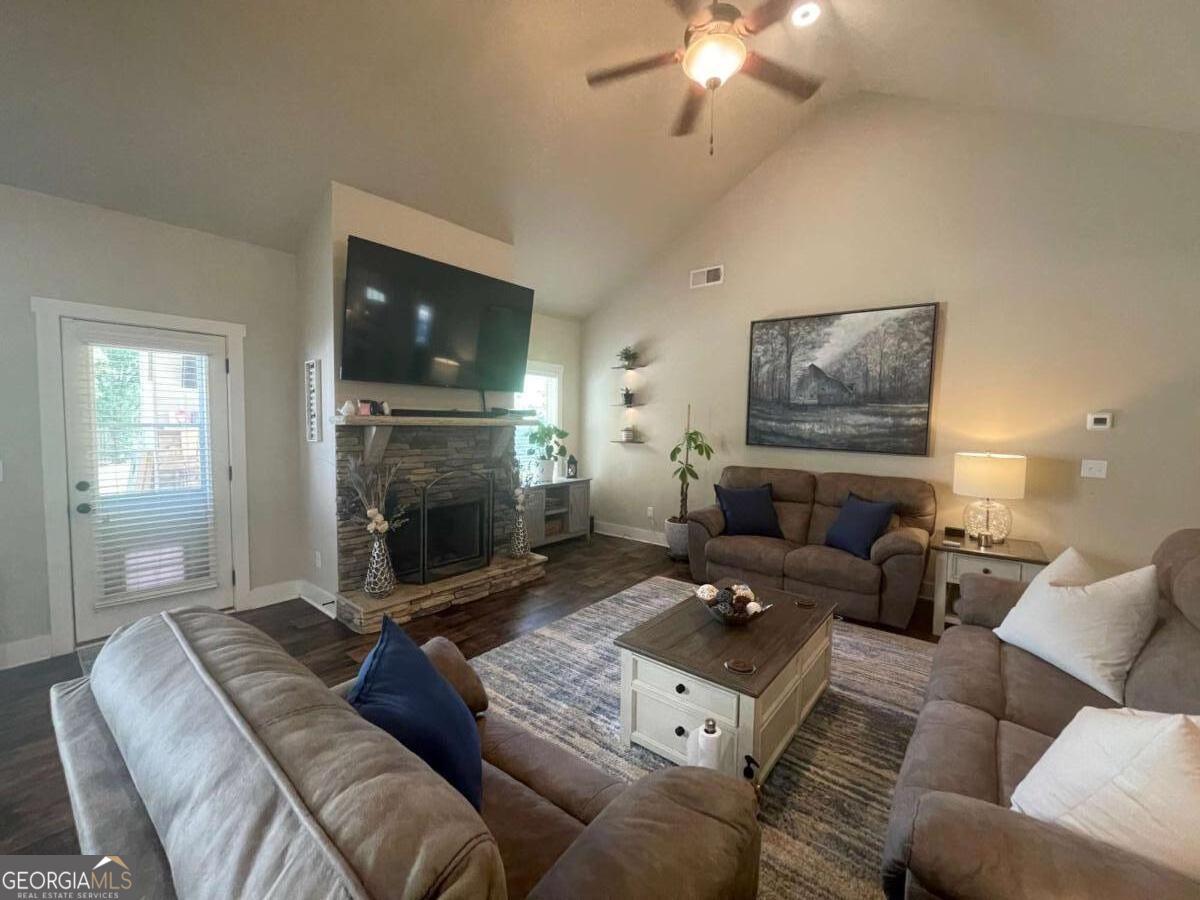 457 Old Good Hope Road Good Hope, GA 30641 - Photo 22 of 59 a living room with furniture a flat screen tv and a fireplace