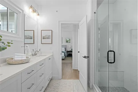 a view of a house with a big yard and a large pool table and chairs