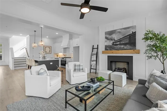 a living room with furniture and a fireplace