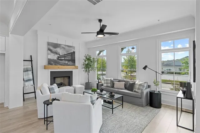a living room with furniture and a fireplace