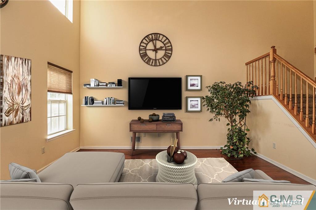 30 Hawthorne Road North Brunswick, NJ 08902 - Photo 11 of 40 a living room with furniture and a flat screen tv
