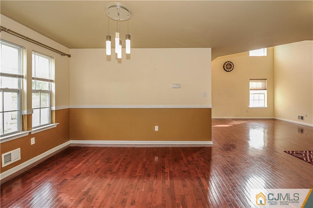 30 Hawthorne Road North Brunswick, NJ 08902 - Photo 12 of 40 a view of empty room with wooden floor and fan
