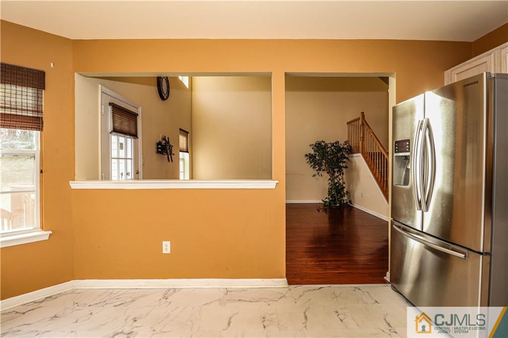 30 Hawthorne Road North Brunswick, NJ 08902 - Photo 18 of 40 a view of a refrigerator in kitchen and an empty room