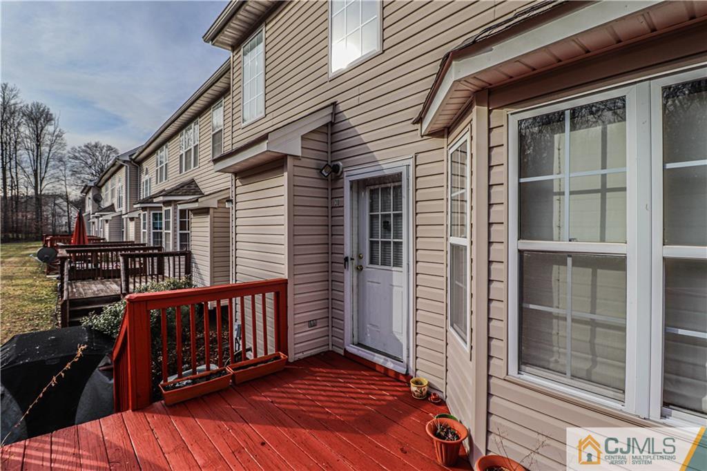 30 Hawthorne Road North Brunswick, NJ 08902 - Photo 21 of 40 a view of a balcony with wooden floor and fence