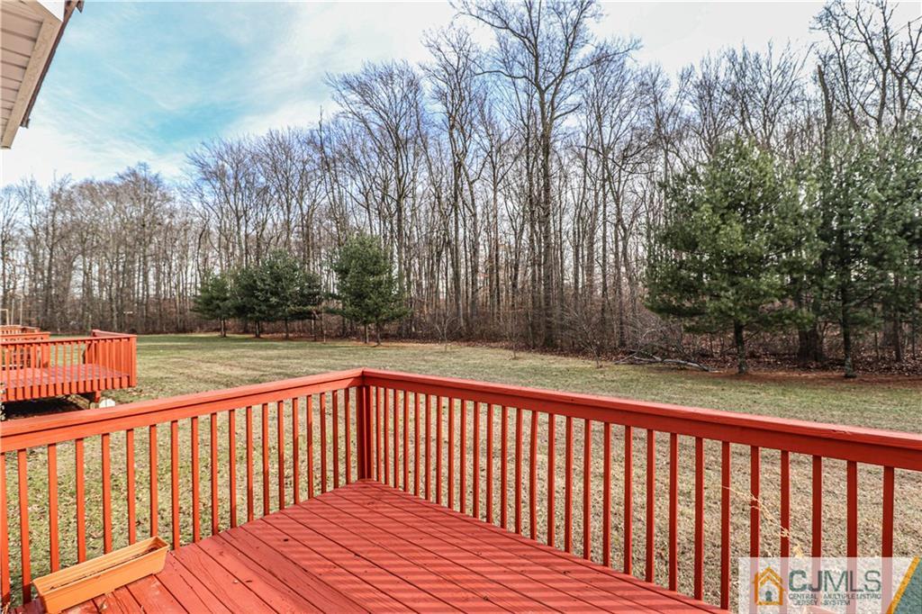 30 Hawthorne Road North Brunswick, NJ 08902 - Photo 22 of 40 a balcony with trees in front of it