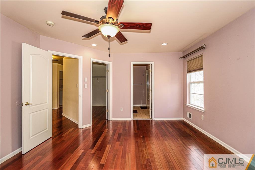 30 Hawthorne Road North Brunswick, NJ 08902 - Photo 24 of 40 a view of an empty room with wooden floor and a window