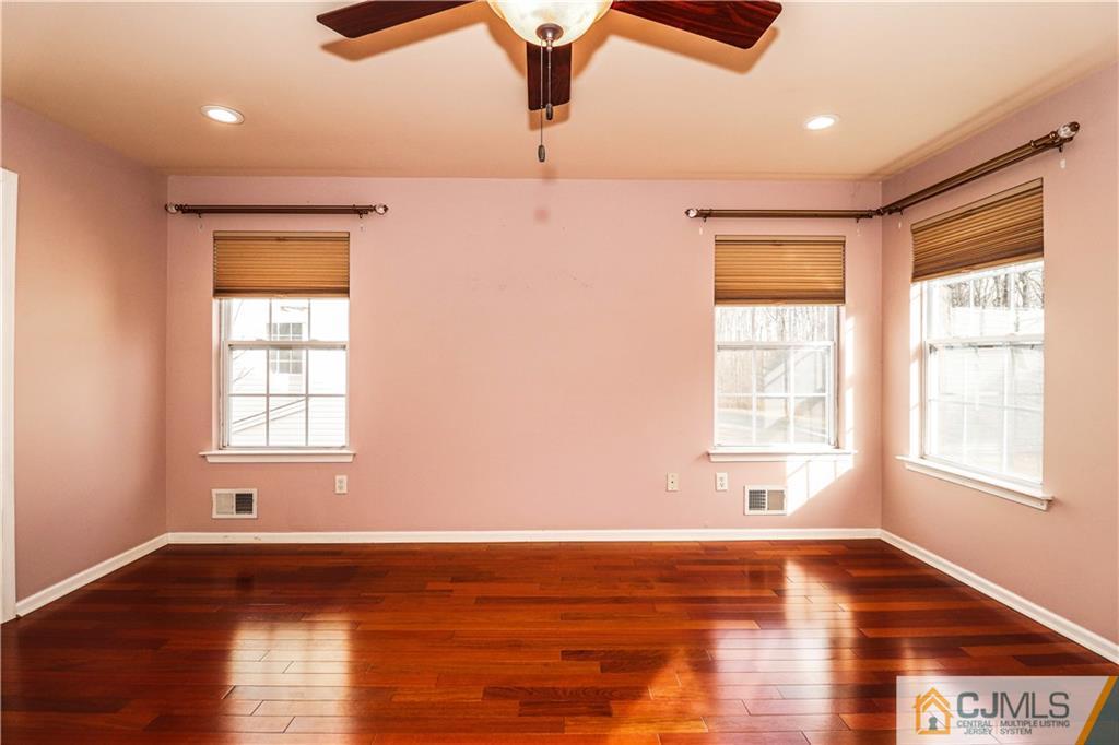 30 Hawthorne Road North Brunswick, NJ 08902 - Photo 25 of 40 a view of an empty room with wooden floor and a window