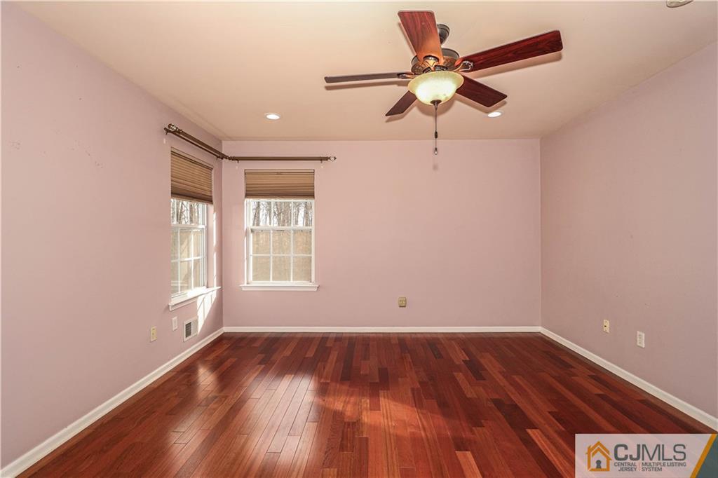 30 Hawthorne Road North Brunswick, NJ 08902 - Photo 27 of 40 wooden floor in an empty room with a window
