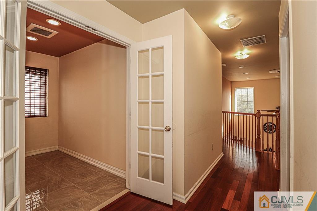 30 Hawthorne Road North Brunswick, NJ 08902 - Photo 28 of 40 a view of entryway with wooden floor