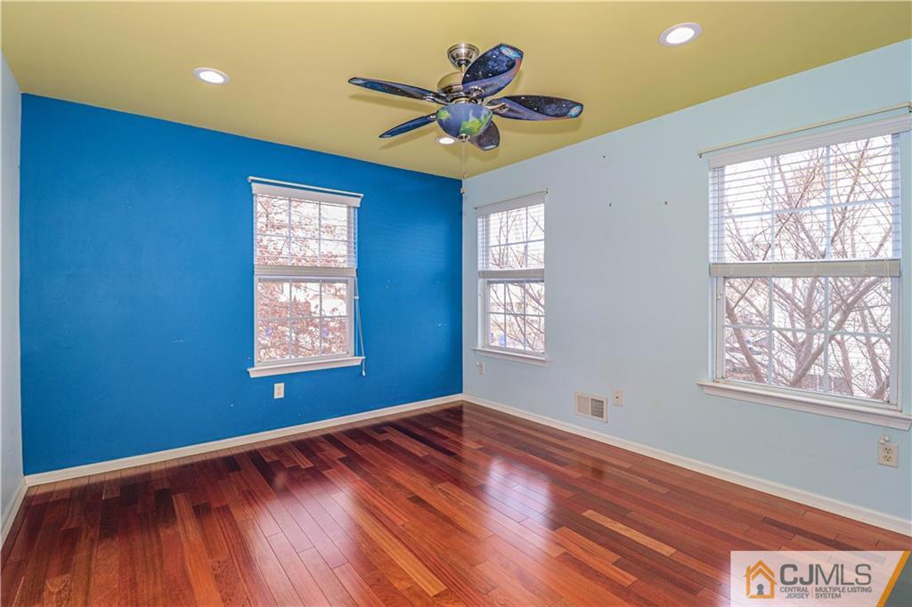 30 Hawthorne Road North Brunswick, NJ 08902 - Photo 30 of 40 a view of empty room with wooden floor and fan