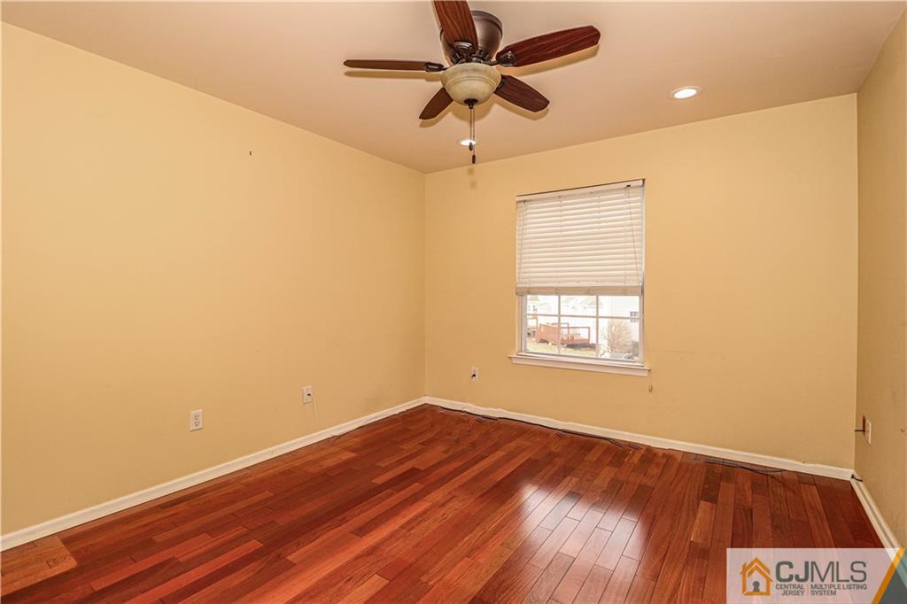 30 Hawthorne Road North Brunswick, NJ 08902 - Photo 31 of 40 a view of an empty room with a window and wooden floor