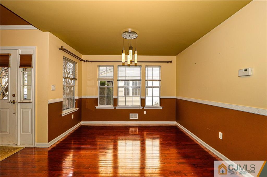 30 Hawthorne Road North Brunswick, NJ 08902 - Photo 6 of 40 a view of empty room with wooden floor and fan
