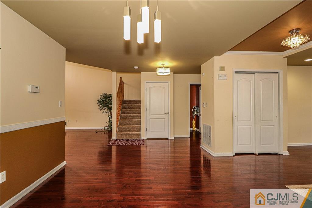 30 Hawthorne Road North Brunswick, NJ 08902 - Photo 8 of 40 a view of empty room with wooden floor