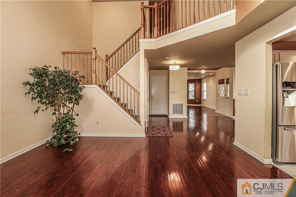 30 Hawthorne Road North Brunswick, NJ 08902 - Photo 9 of 40 a view of entryway and hall with wooden floor