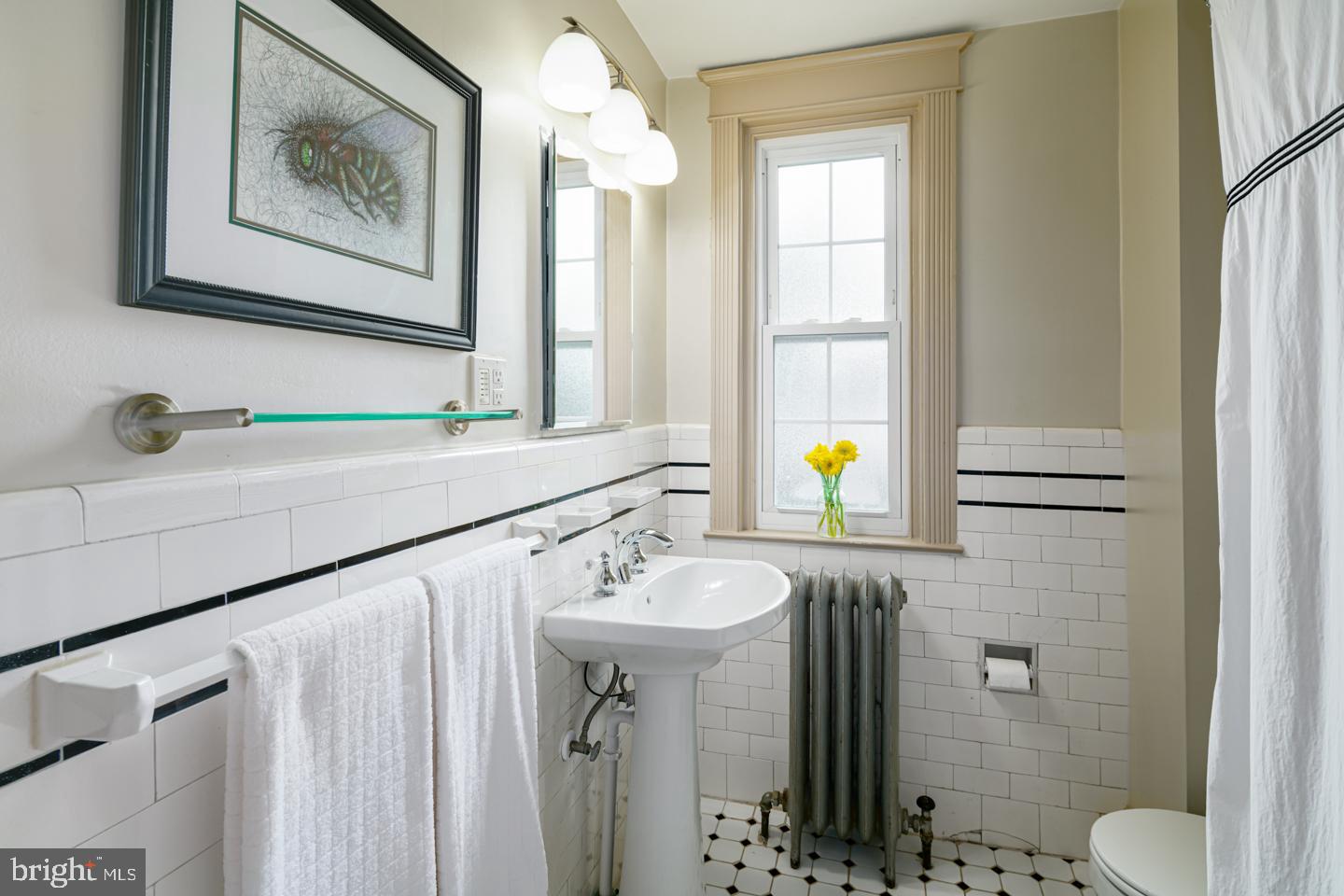 54 Wellington Road Ardmore, PA 19003 - Photo 24 of 26 a bathroom with a sink and a mirror