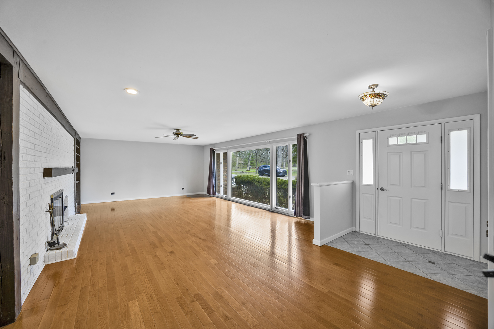 5514 North 13000th Road East Momence, IL 60954 - Photo 5 of 27 a view of empty room with wooden floor and fan
