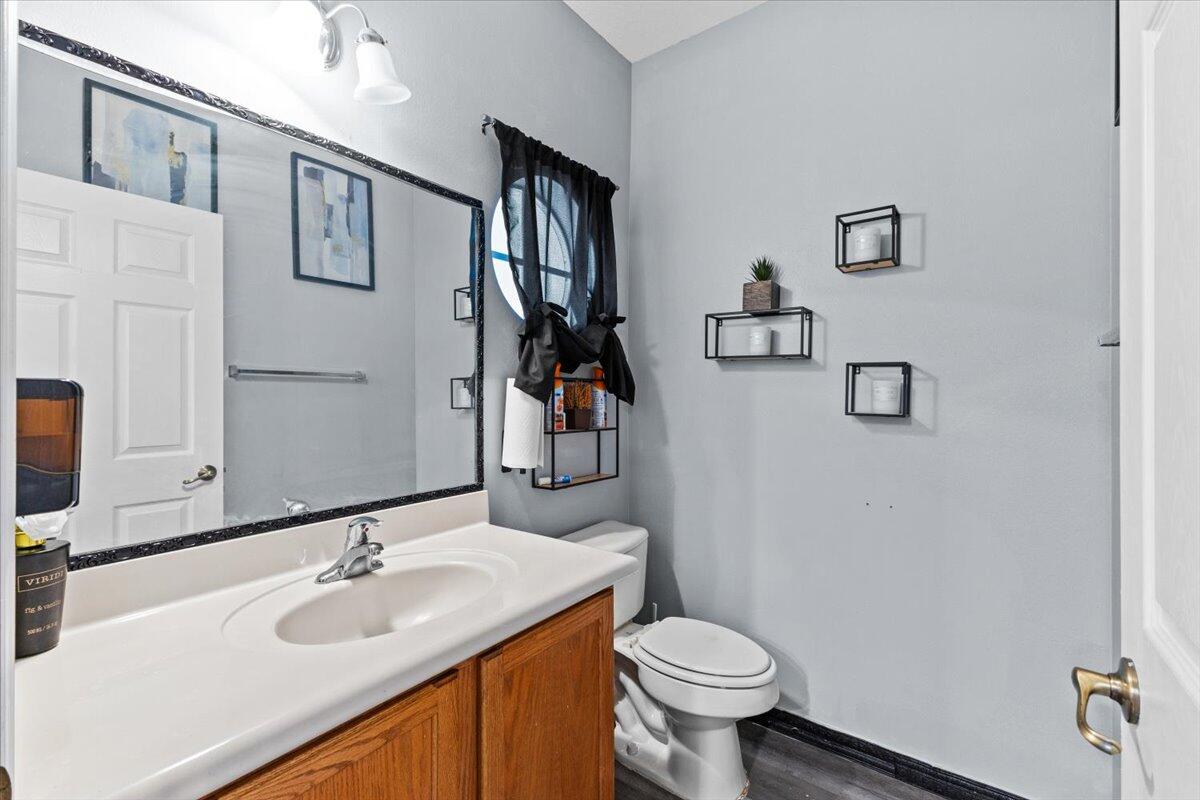 2227 Oakmont Drive Riviera Beach, FL 33404 - Photo 19 of 43 a bathroom with a sink toilet and mirror