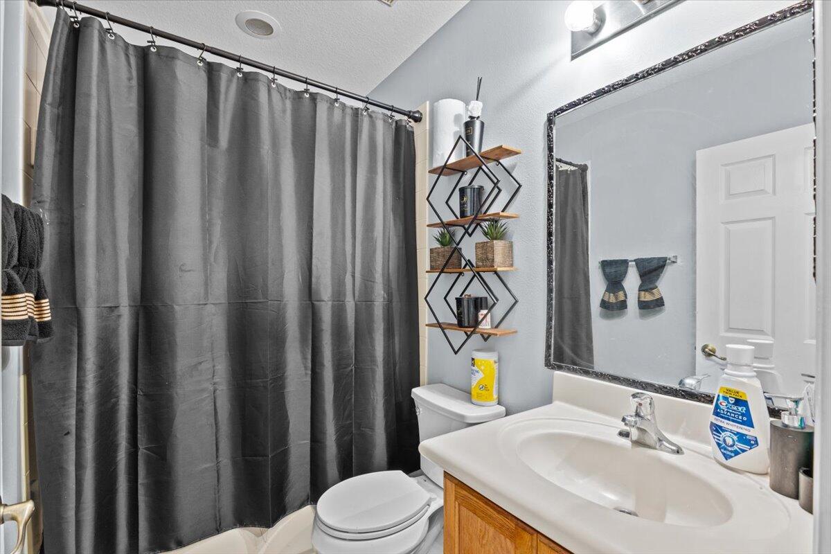 2227 Oakmont Drive Riviera Beach, FL 33404 - Photo 33 of 43 a bathroom with a sink and a mirror