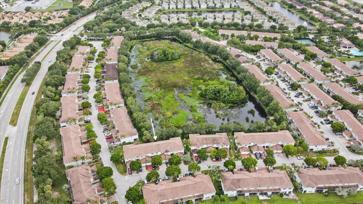 2227 Oakmont Drive Riviera Beach, FL 33404 - Photo 39 of 43 an aerial view of residential houses with outdoor space