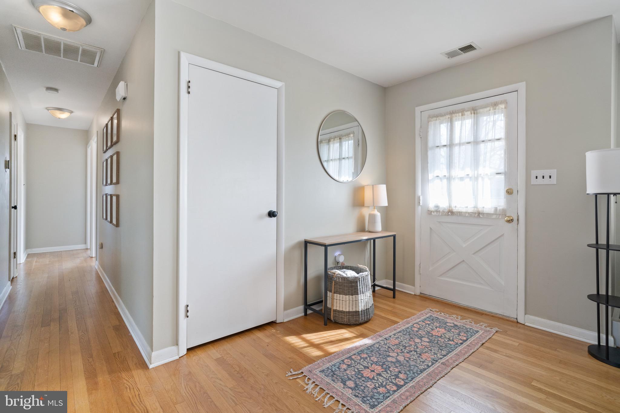 1204 Random Ridge Road Westminster, MD 21157 - Photo 2 of 33 a view of a hallway with wooden floor and a window