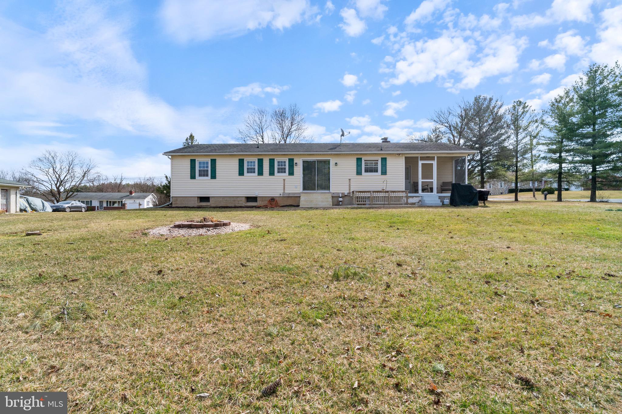1204 Random Ridge Road Westminster, MD 21157 - Photo 33 of 33 a view of a house with a big yard and large trees
