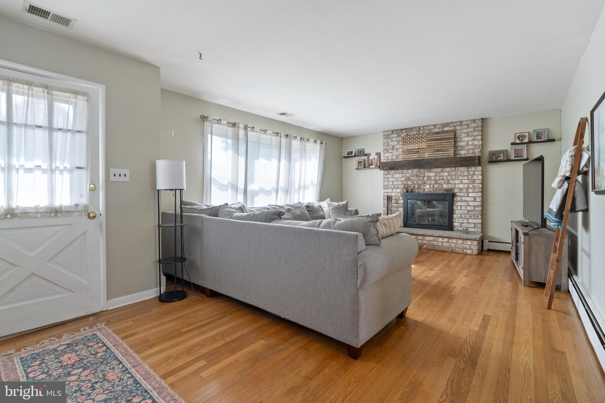 1204 Random Ridge Road Westminster, MD 21157 - Photo 4 of 33 a living room with furniture and a fireplace