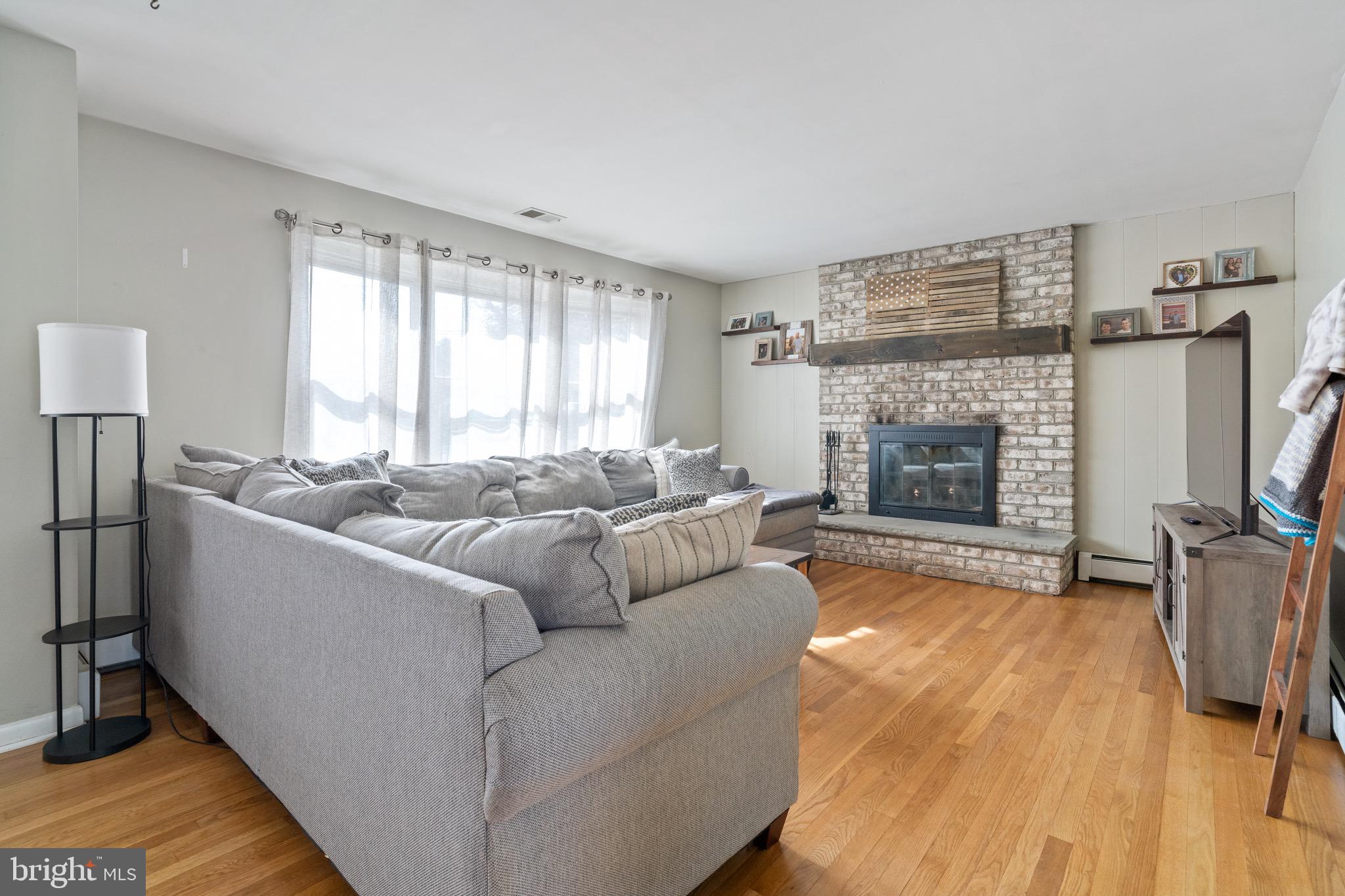 1204 Random Ridge Road Westminster, MD 21157 - Photo 5 of 33 a living room with furniture and a fireplace